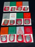 (12) Sterling Towle Christmas medallions (1971 thru 1982 years). Approx. (8) ounces sterling total.