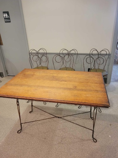 Oak parlor table with metal base and 6 matching chairs