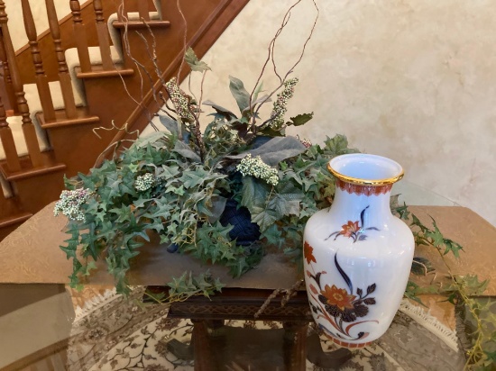 Ivy floral arrangement with porcelain vase