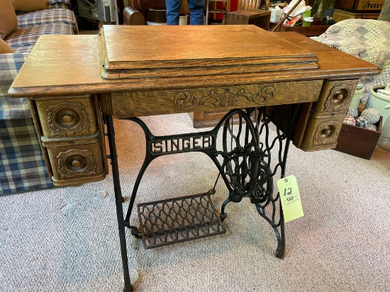 Singer treadle sewing machine with oak case