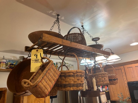 Decorative drying rack with turned wood bowls, new and old baskets, metal pot