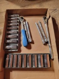 Box of deep well standard and metric sockets, 3/8 drive ratchets, extensions