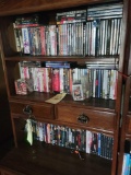 3 shelves of assorted dvds