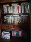 3 shelves of assorted dvds