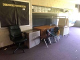 Two teachers desk, student staff chairs, file cabinet, easel and table