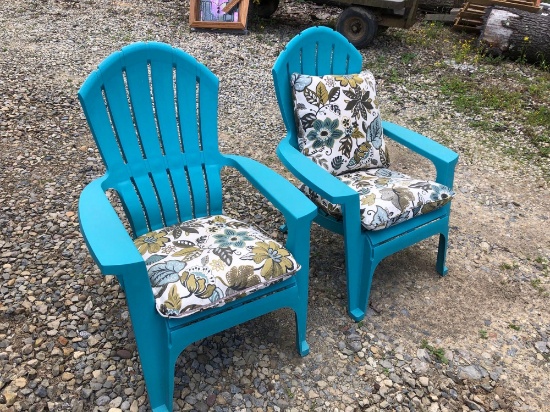 Two turquoise plastic lawn chairs with three weatherproof
