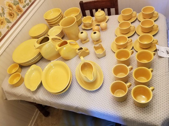 Large set of yellow Fiesta pottery