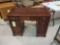 Kneehole mahogany desk with decorative trim