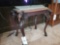 Heavily carved horse head table with decorative top