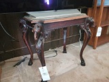 Heavily carved horse head table with decorative top