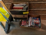 boxes of cookbooks and western memorabilia