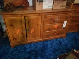 Pair of western themed stenciled dressers