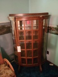 Early curved glass curio with panel door