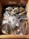 Box of small arrowheads, rock