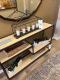 decorative candle holder, baskets, and faux plants