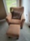 Upholstered bedroom chair with ottoman and accent pillow
