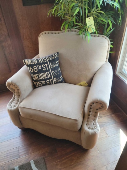 Lilly upholstered chair with nail head trim and accent pillow