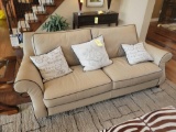 American Signature leather style sofa with 3 accent pillows