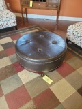 Leather finish ottoman with nail head trim