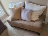 Upholstered bedroom bench with accent pillows