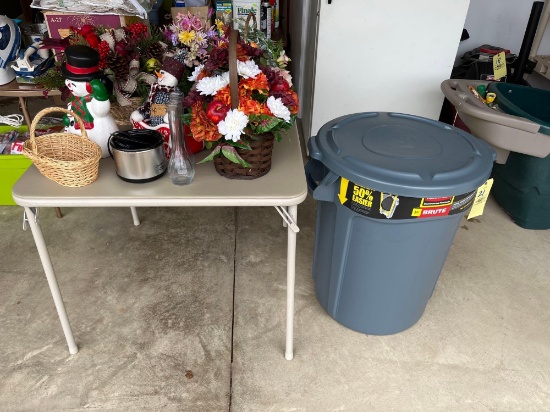 like new Brute trash bin, artificial flowers, card table