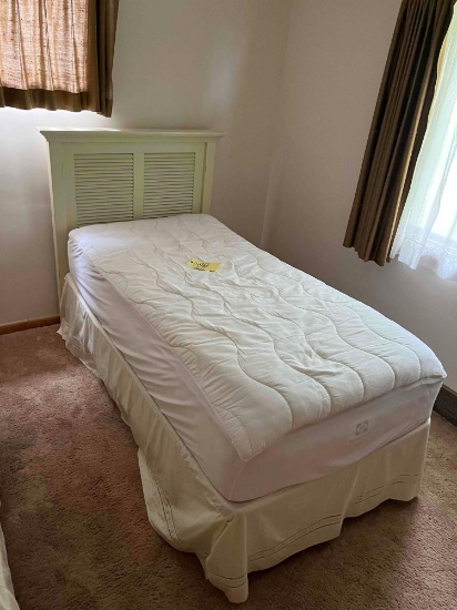 twin sized bed with headboard