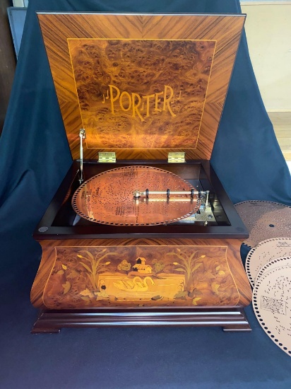 Porter windup music disc player w/ (7) 12.25" metal discs, inlaid swans & other scenes on cabinet.