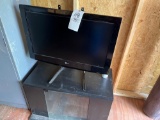 lg. TV - stand - microwave, fan, MAC mud flap, galvanized can