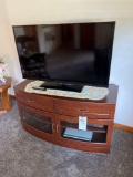 Samsung flat screen TV, stand, and VHS player