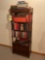 assortment of hardback books and book shelf