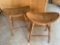 Pair of oak saddle type bar stools, 24