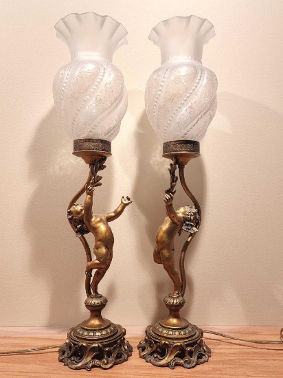 Pair of spelter cherub / putti lamps w/ glass shades