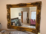 large fancy carved room size gold framed mirror