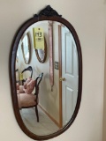 oval wood framed mirror