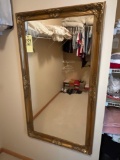 large gold framed mirror