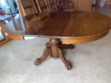 Antique oak claw-footed pedestal extension table, 63.5