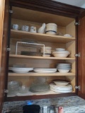 contents of kitchen cupboards including dishware, pots and pans and utensils