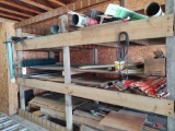 contents of wood shelf including rough sawn lumber and some copper