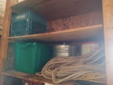 contents of shelf including ropes, chains, crates and buckets