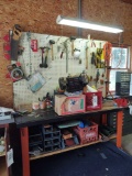 workbench with assorted hand tools, Hardware and Craftsman bench grinder