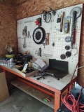 workbench with assorted sprays and Hardware