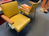 two yellow office chairs, two desks