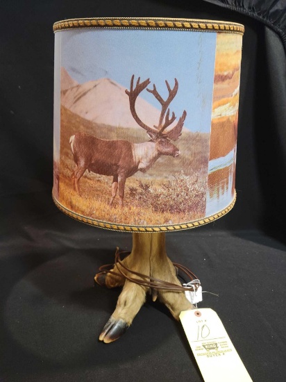 Taxidermy deer foot lamp with wildlife themed shade