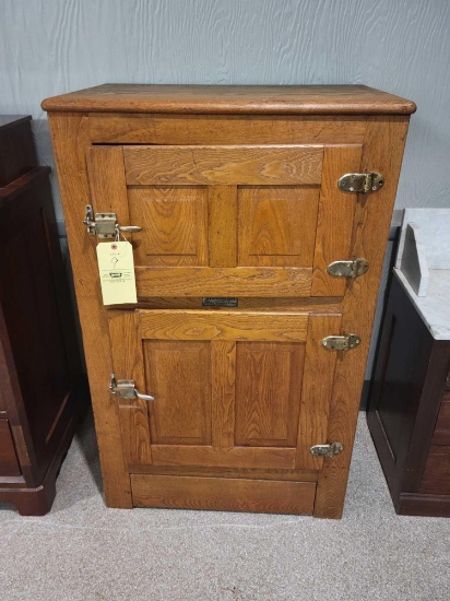 American Refrigerator oak ice box with casters and inside original