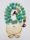 Old carved butterfly and green opal glass beaded necklace