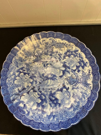 Antique blue floral decorated Asian charger, 24" diameter.