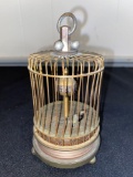 Windup bird in cage clock, bird moves from side to side.