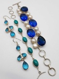 (2) silver bracelets and dangle earrings