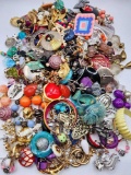 Unsorted costume jewelry: single earrings and parts