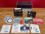 (2) View Masters w/ (24) reels of stereo slides.